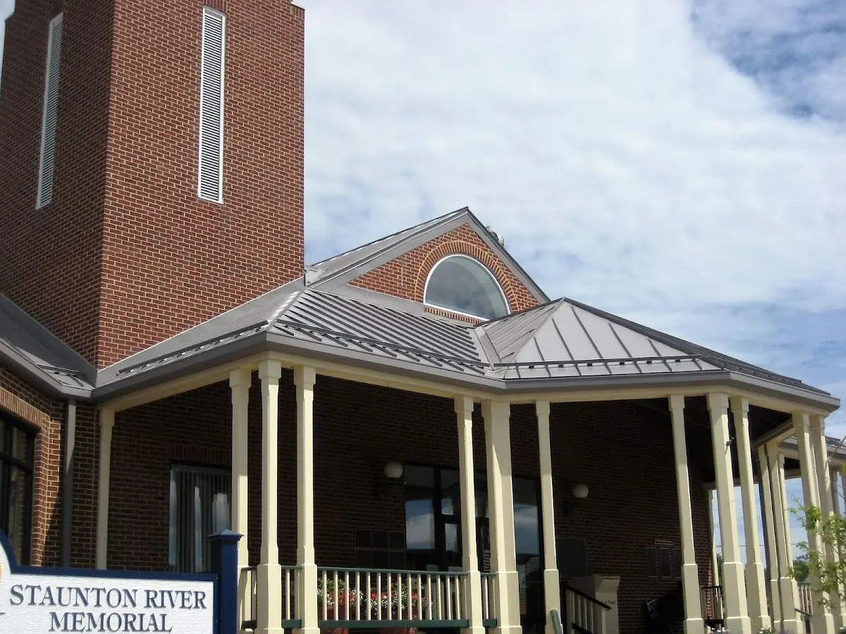 Skilled roofing craftsmen working on a residential roof in Jefferson Valley